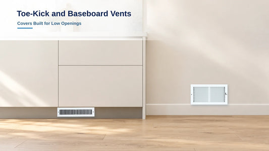 White toe-kick vent in a cabinet base next to a baseboard supply register above the skirting