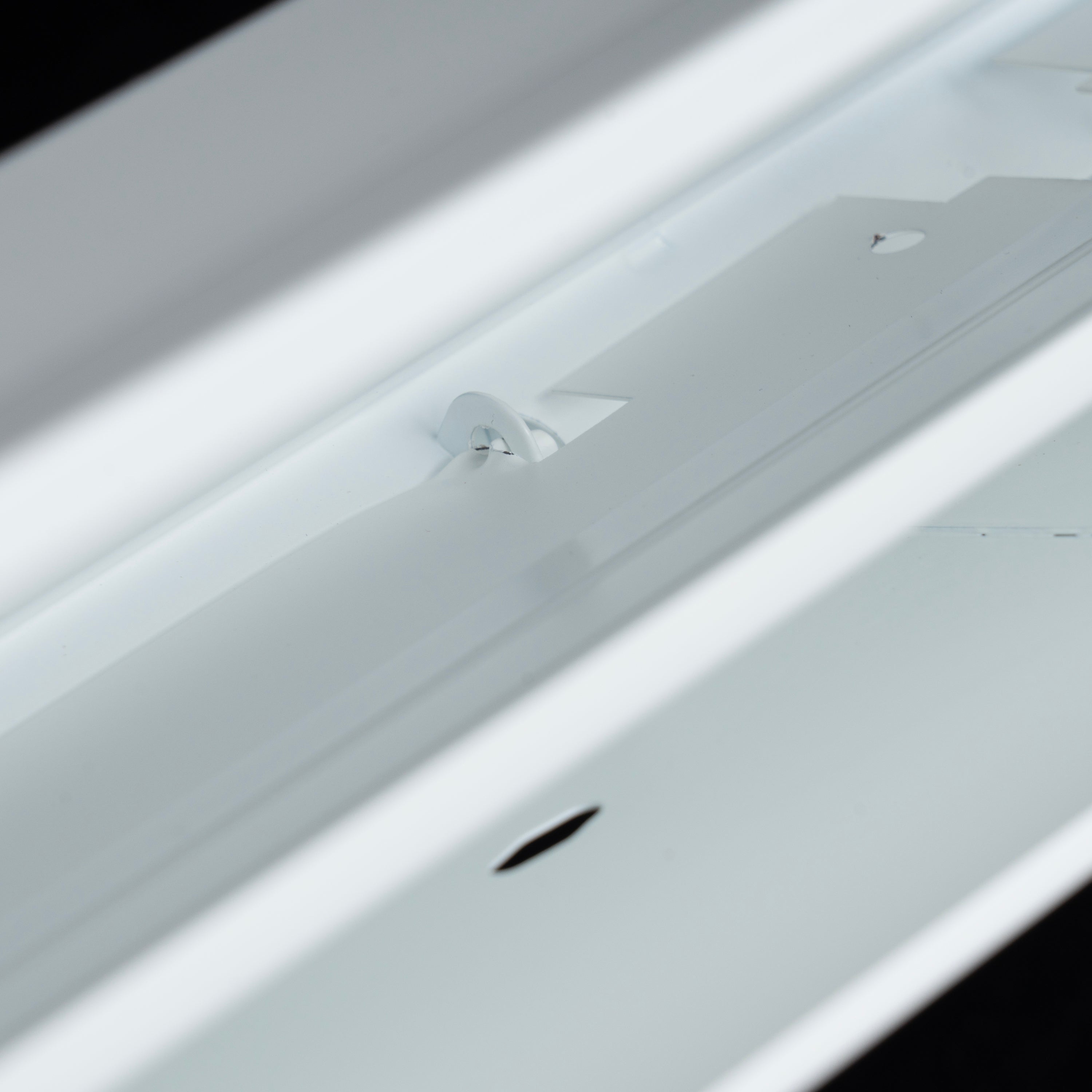 48" White Steel corner baseboard supply register, flush latch detail