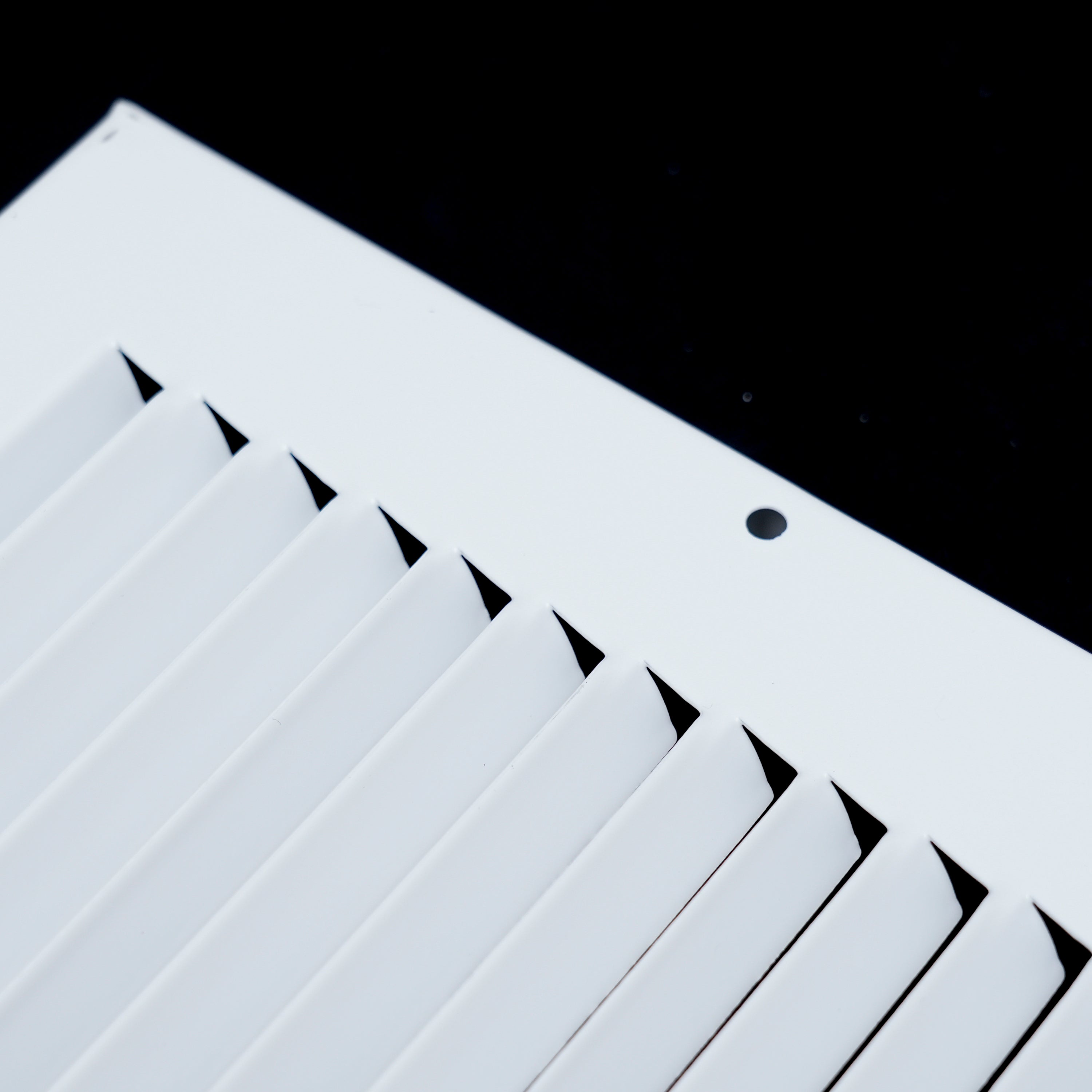 12 x 4-inch White Steel baseboard return grille, frame corner detail